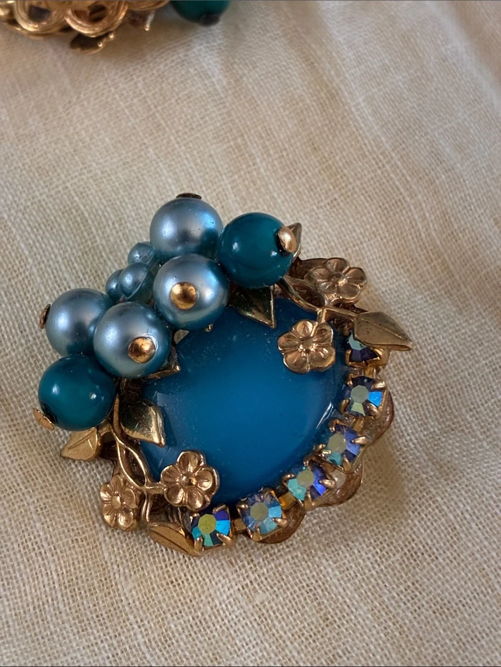 Artisan clip earrings created with vintage components in Aqua